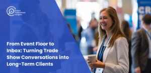 Smiling business professionals networking at a trade show event, representing Global Tradeshows Insights’ guide on turning trade show conversations into long-term client relationships.