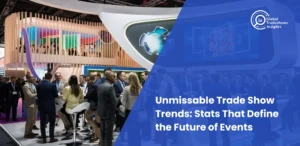 Crowds networking at a modern trade show booth with digital displays, representing Global Tradeshows Insights and highlighting key trade show trends and statistics.